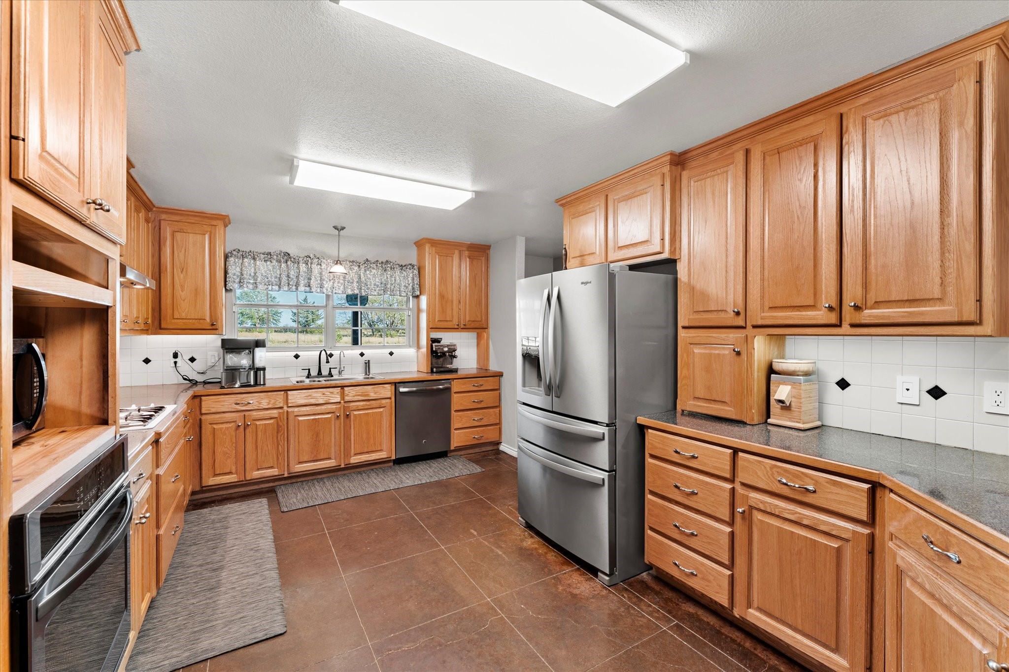 3115 Rains County Road 2610 Alba, TX 75410 - Photo 13 of 49 a kitchen with granite countertop stainless steel appliances and cabinets