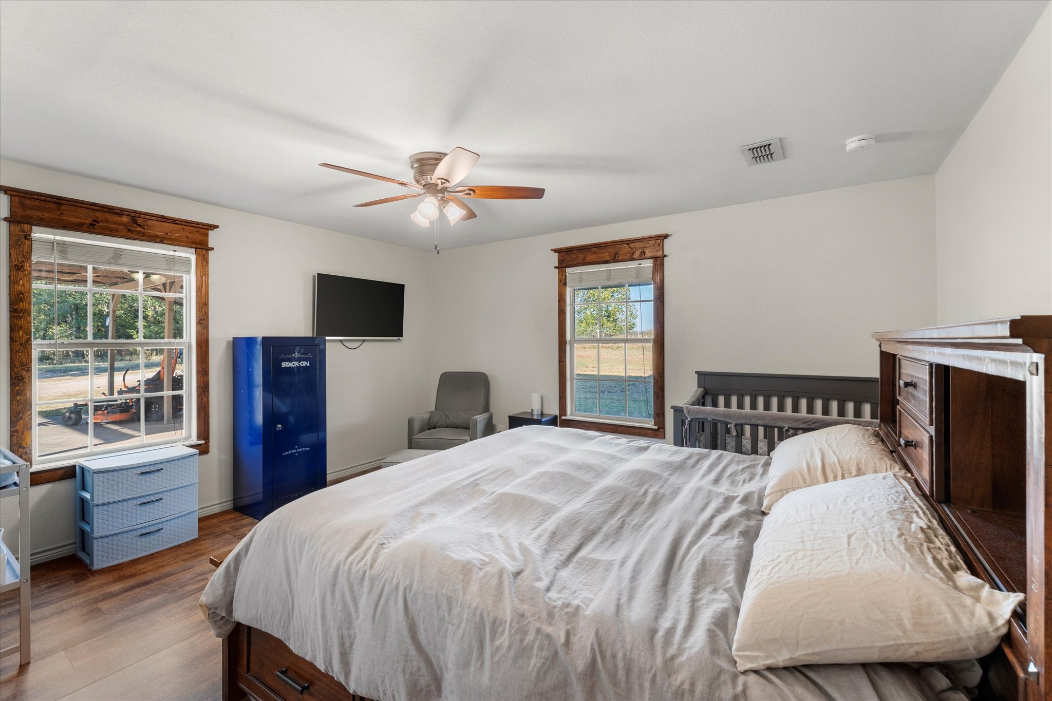 3115 Rains County Road 2610 Alba, TX 75410 - Photo 16 of 49 a bedroom with a bed a dresser and flat screen tv