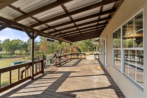a view of a balcony with wooden floor