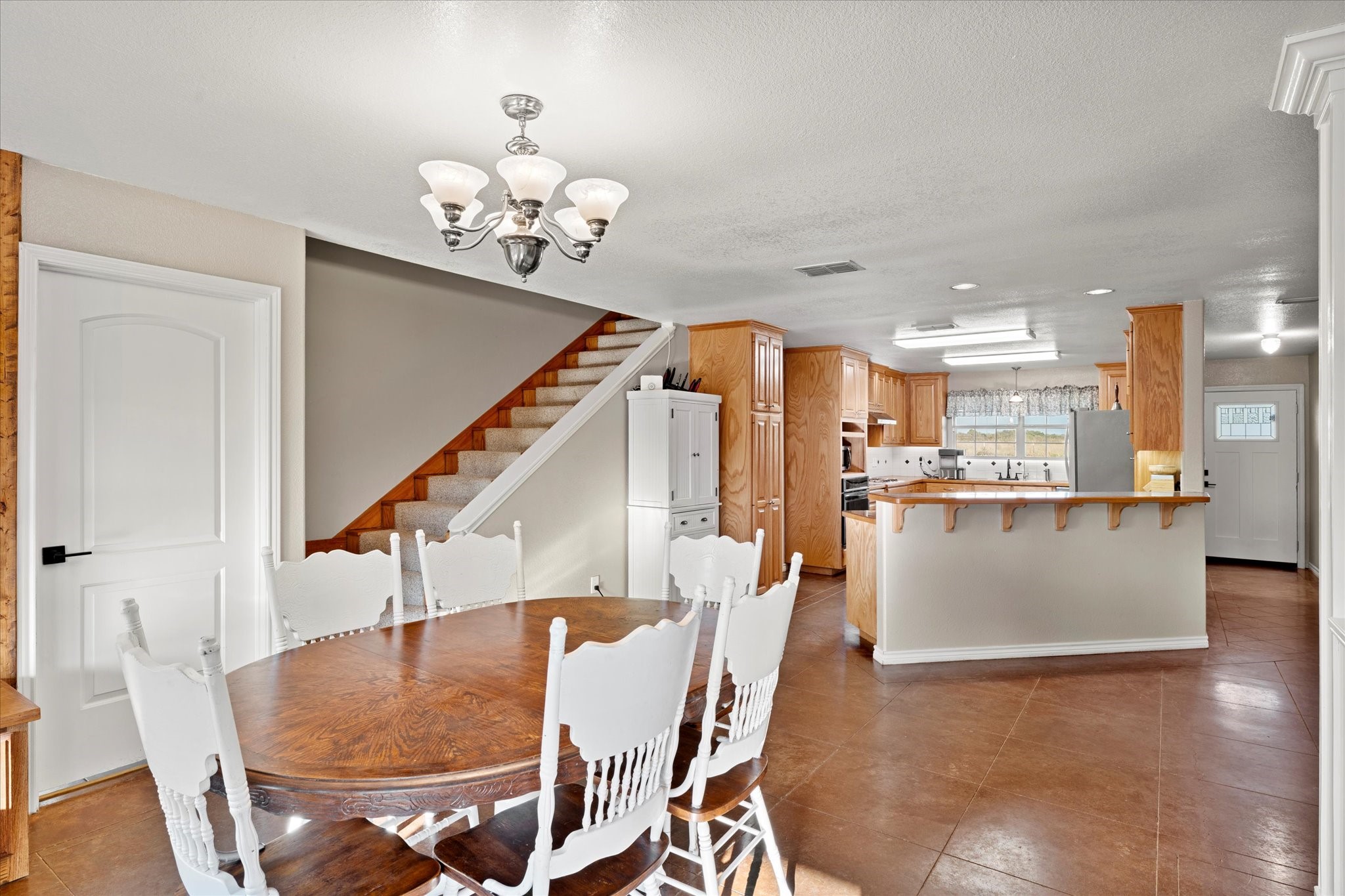 3115 Rains County Road 2610 Alba, TX 75410 - Photo 6 of 49 a view of a dining room with furniture and wooden floor