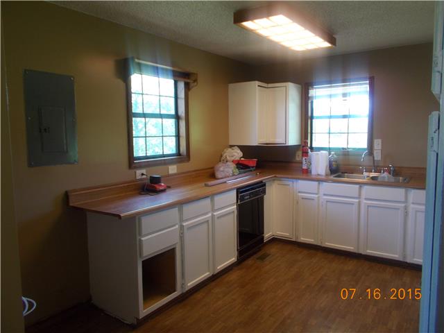385 Chicken Creek Road Pulaski, TN 38478 - Photo 1 of 15 a kitchen with a sink stove and cabinets