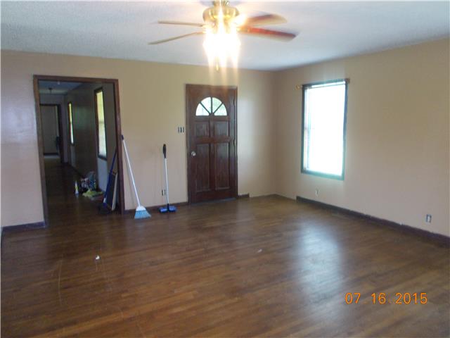385 Chicken Creek Road Pulaski, TN 38478 - Photo 10 of 15 an empty room with wooden floor and windows