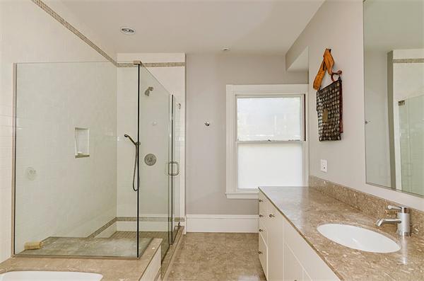 33 Manchester Road Brookline, MA 02446 - Photo 12 of 23 a bathroom with a granite countertop sink mirror and shower