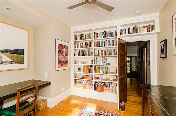 33 Manchester Road Brookline, MA 02446 - Photo 15 of 23 a living room with fish tank and a bookshelf