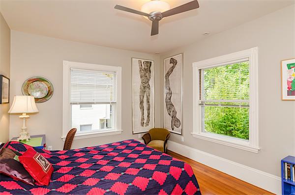 33 Manchester Road Brookline, MA 02446 - Photo 17 of 23 a view of a bedroom with a bed and wooden floor