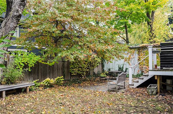 33 Manchester Road Brookline, MA 02446 - Photo 22 of 23 a backyard of a house with lots of green space