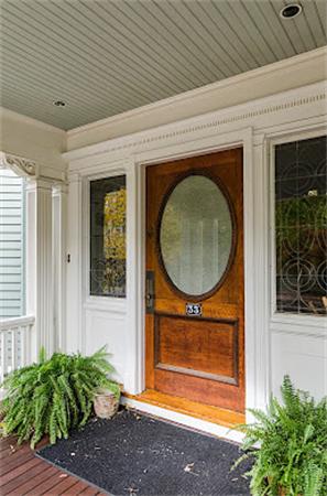 33 Manchester Road Brookline, MA 02446 - Photo 3 of 23 a front view of a house with garden