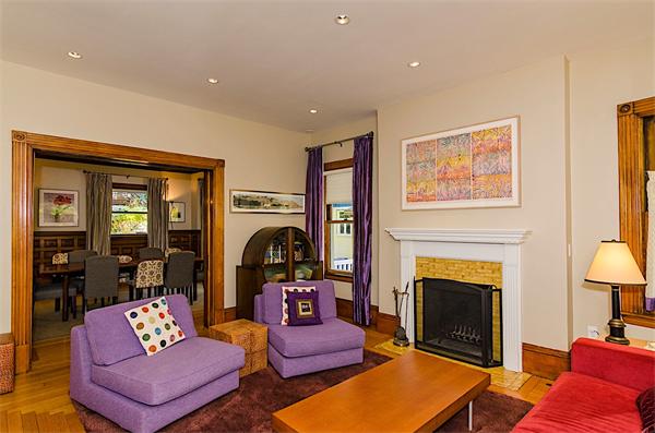 33 Manchester Road Brookline, MA 02446 - Photo 5 of 23 a living room with furniture flat screen tv and a fireplace