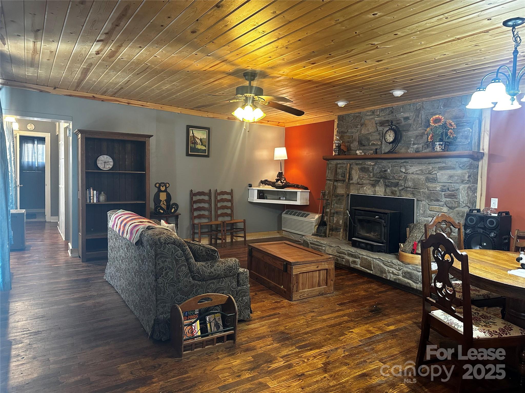 717 Deep Gap Road Burnsville, NC 28714 - Photo 13 of 23 a living room with furniture and a fireplace