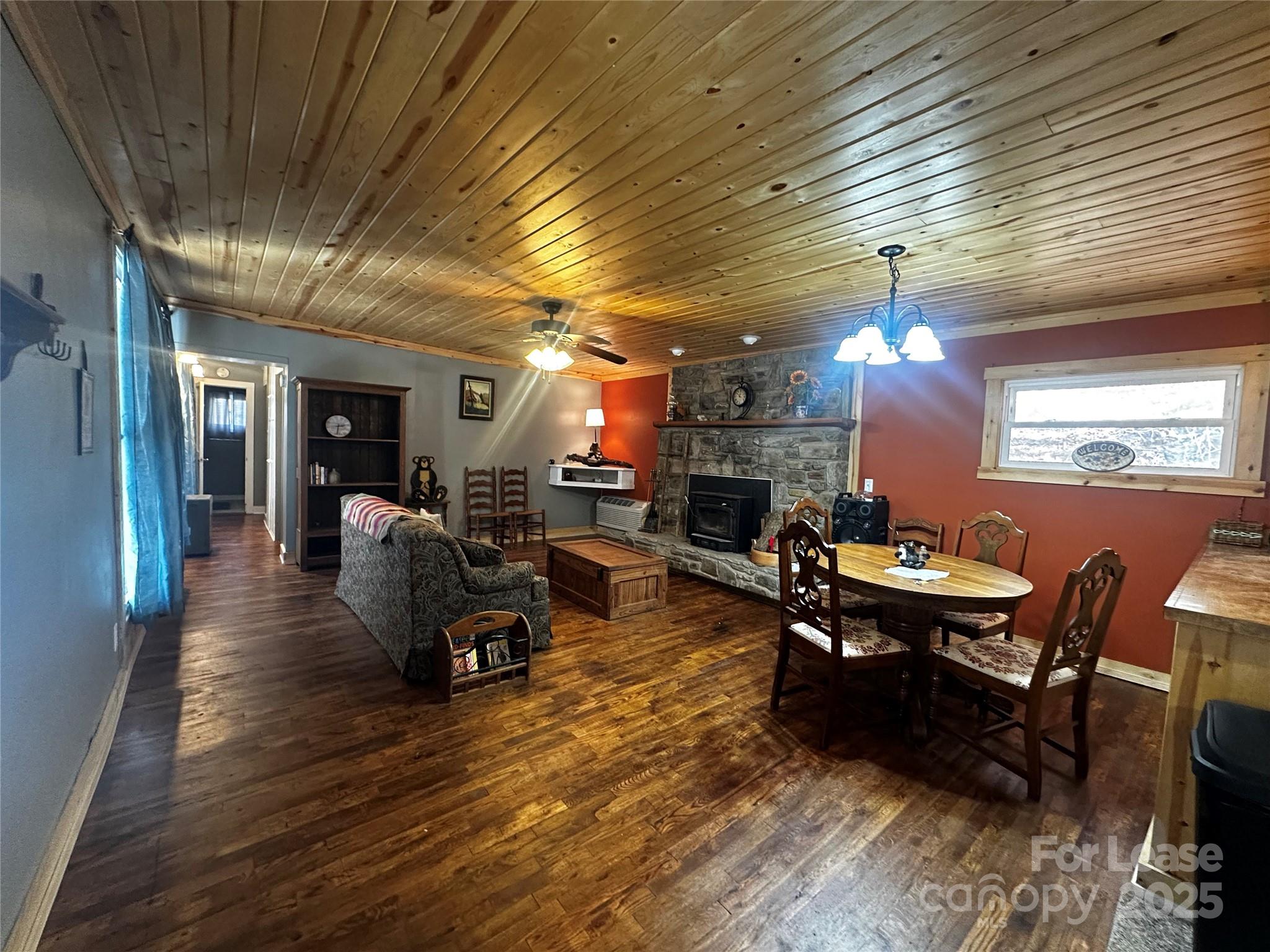 717 Deep Gap Road Burnsville, NC 28714 - Photo 14 of 23 a living room with furniture and a wooden floor
