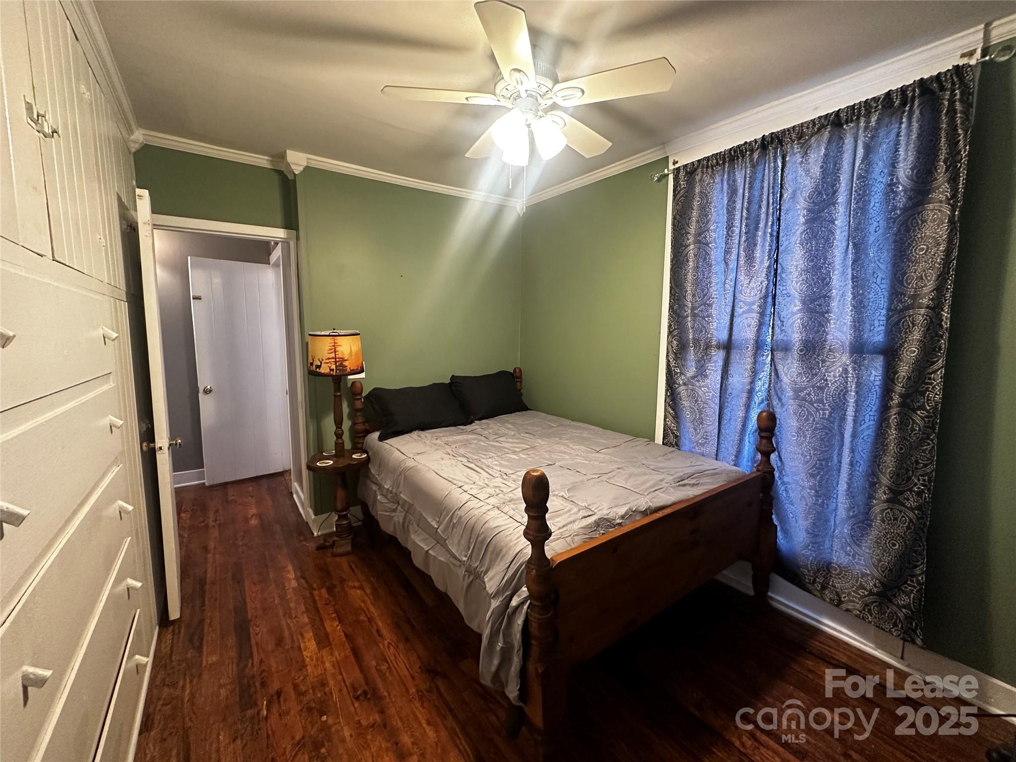 717 Deep Gap Road Burnsville, NC 28714 - Photo 15 of 23 a bedroom with a bed and a mirror