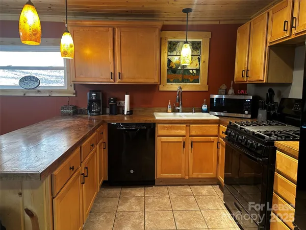 a kitchen with a sink and a stove