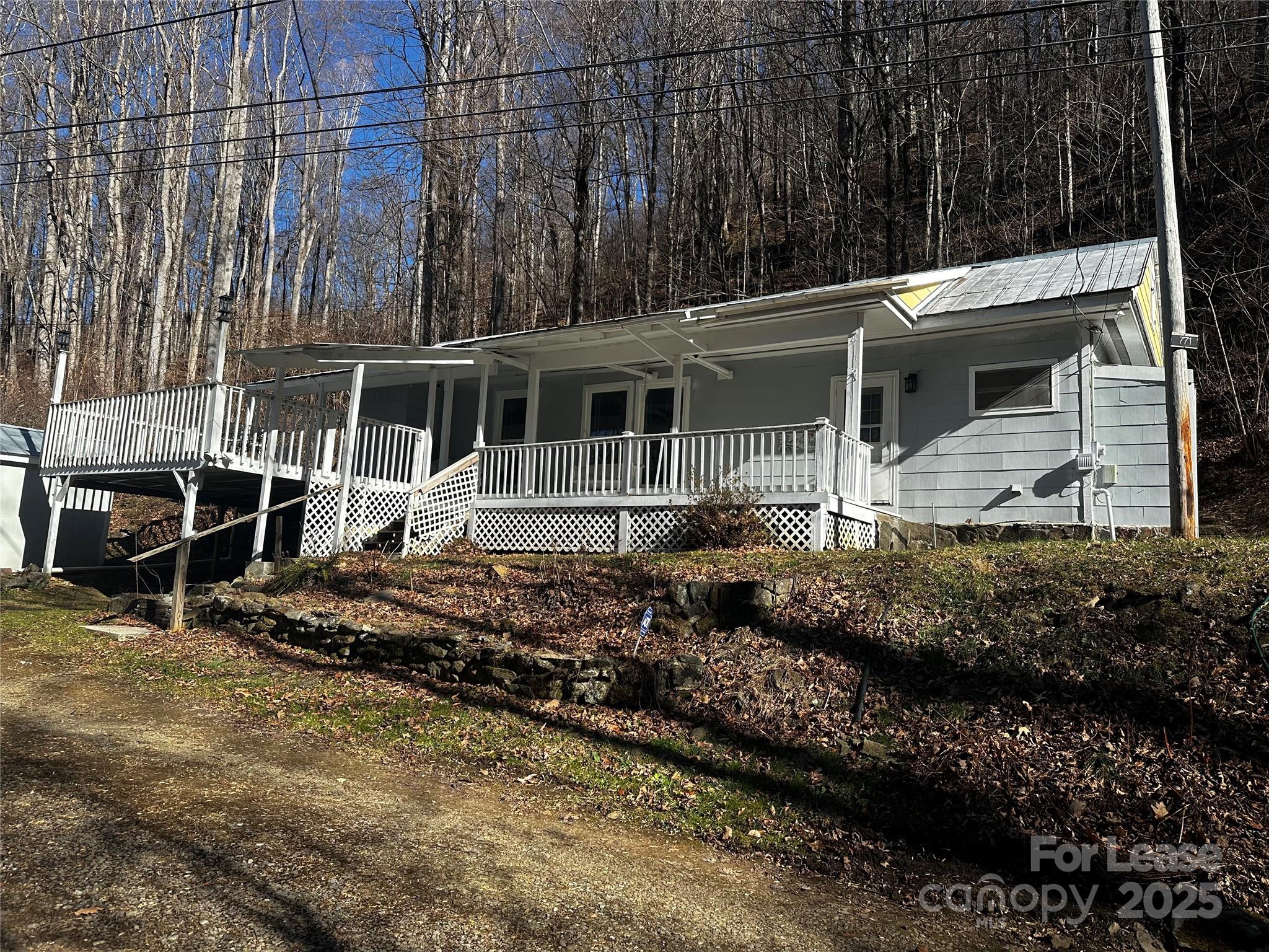 717 Deep Gap Road Burnsville, NC 28714 - Photo 23 of 23 a house view with a garden space