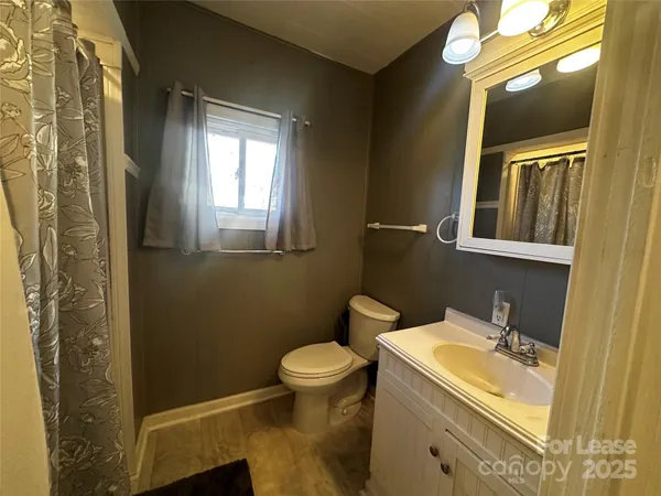 a close view of a utility room with dryer and washer