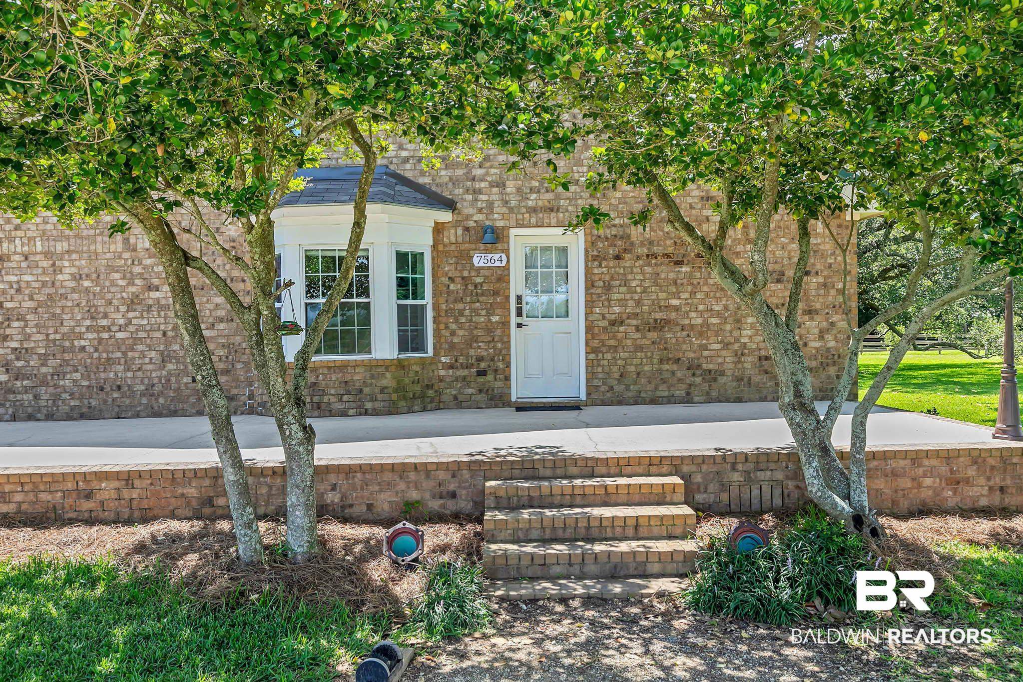 7564 Rabbit Run Road Fairhope, AL 36532 - Photo 4 of 88 Doorway to property with brick siding