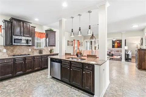 a living room with furniture fireplace and a flat screen tv