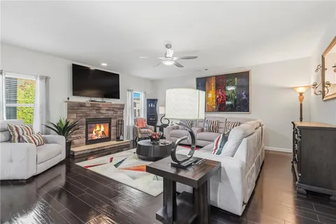 a bedroom with a bed and dresser with mirror