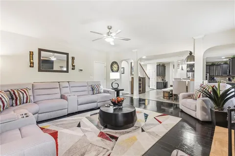 a bedroom with a bed dresser and a baby crib