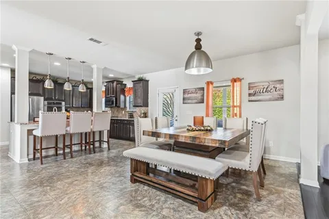 a kitchen with granite countertop lots of counter top space and stainless steel appliances