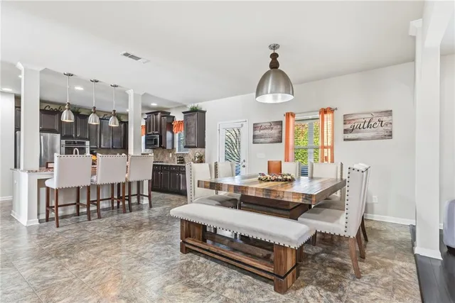 a kitchen with granite countertop lots of counter top space and stainless steel appliances