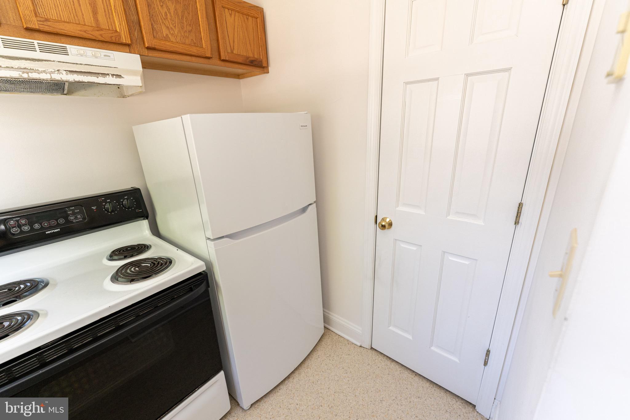 804 Travers Street, Unit 2 Cambridge, MD 21613 - Photo 11 of 26 a view of kitchen with washer and dryer