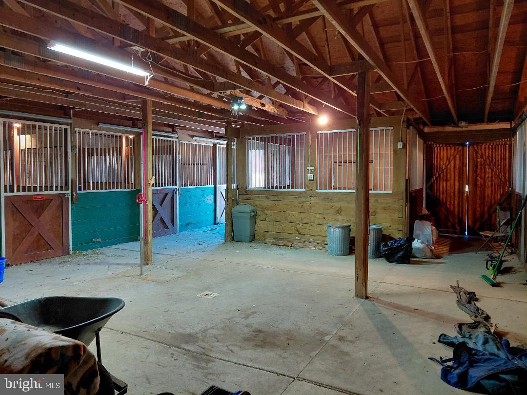 91 Stewart Road Pilesgrove, NJ 08098 - Photo 21 of 27 Spacious equestrian barn interior.