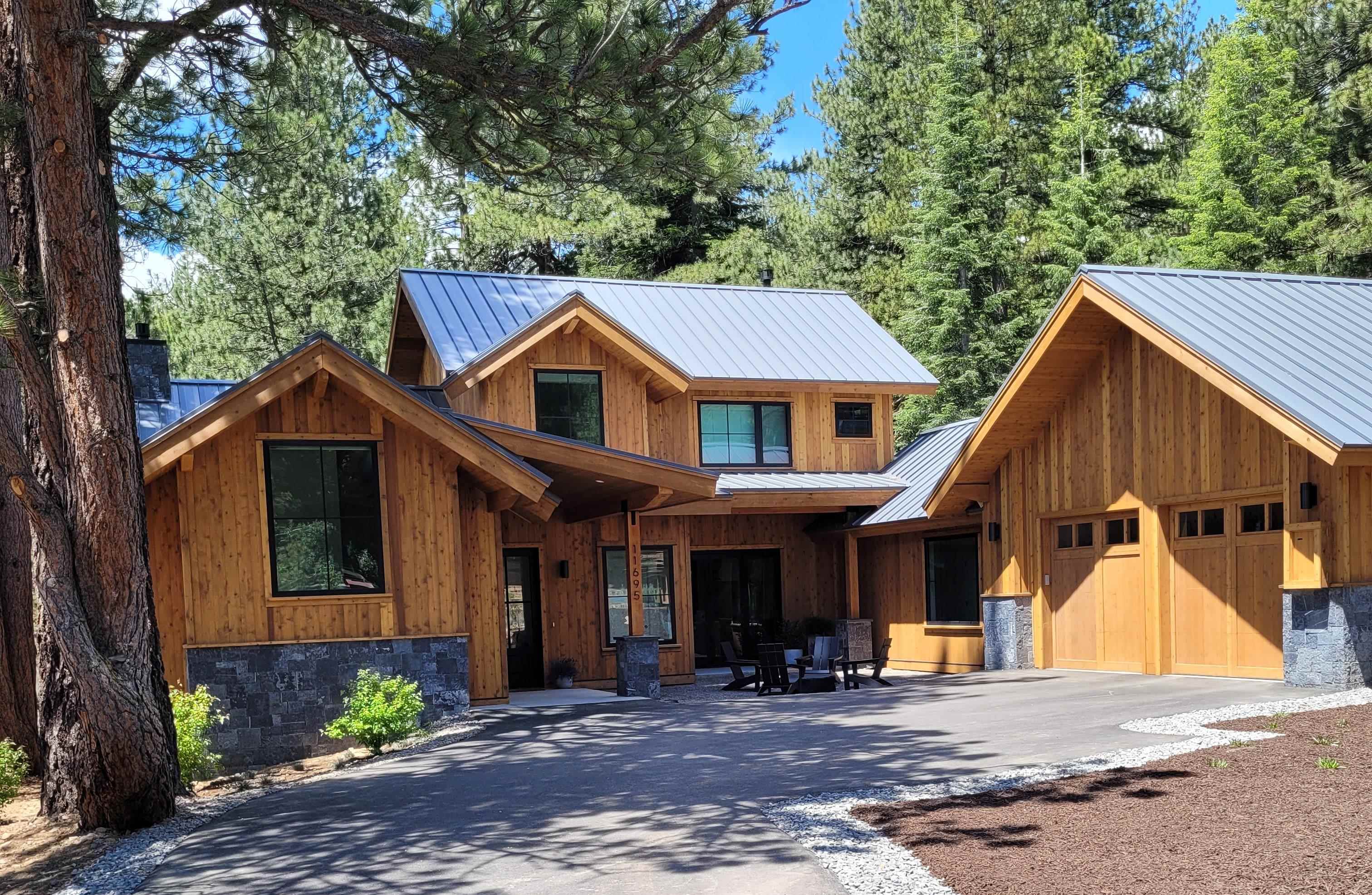 11695 Kelley Drive Truckee, CA 96161 - Photo 1 of 1 a view of a white house with large windows and a small yard