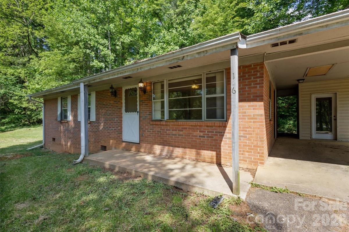 156 Old Sweetwater Road Robbinsville, NC 28771 - Photo 2 of 25 a view of a house with backyard