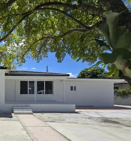 a front view of a house with a garage