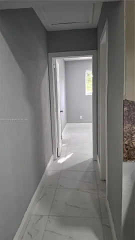 a view of entryway with bathroom