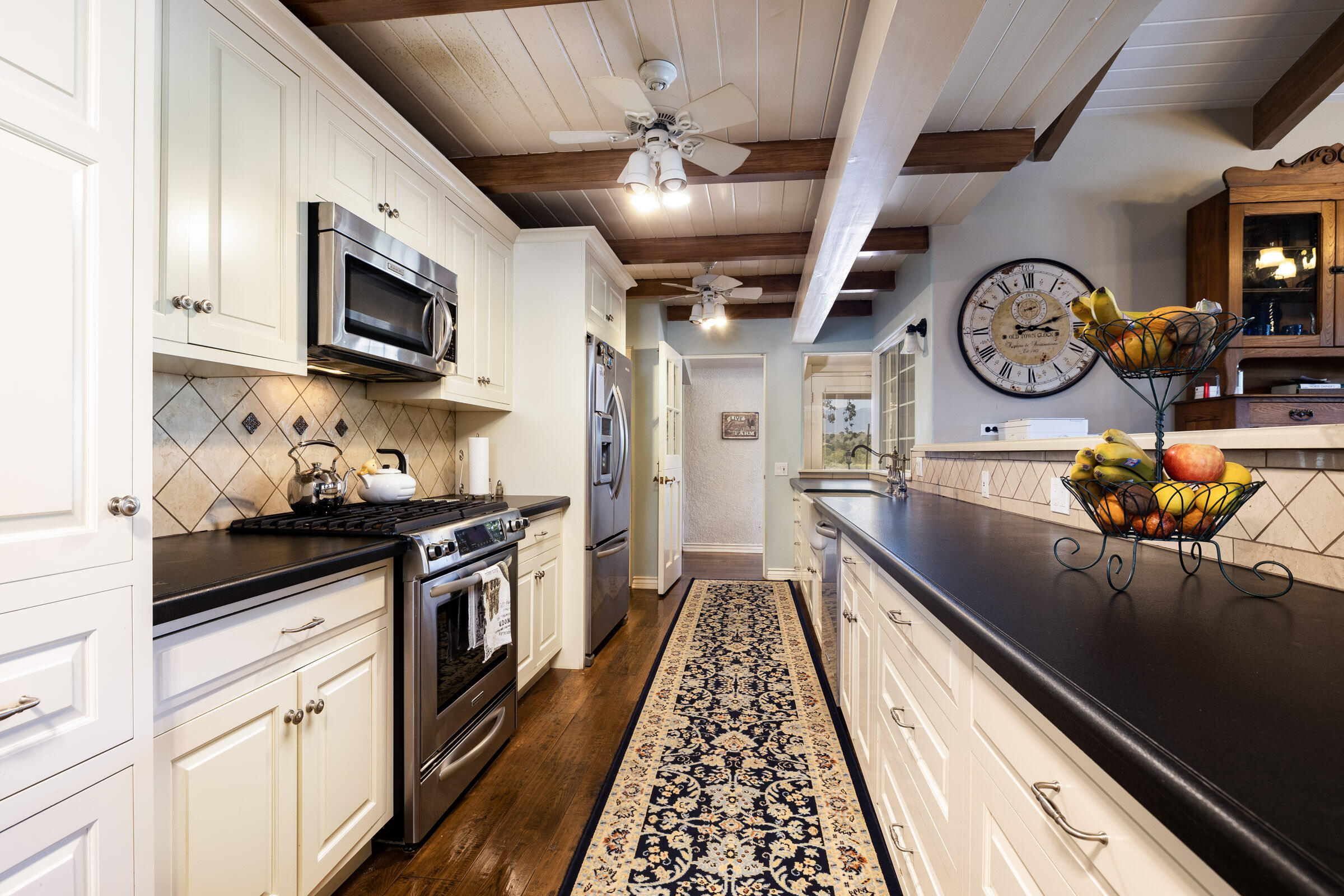 120 Meadowlark Road Santa Ynez, CA 93460 - Photo 11 of 42 a kitchen with stainless steel appliances granite countertop a stove and a sink with granite countertops