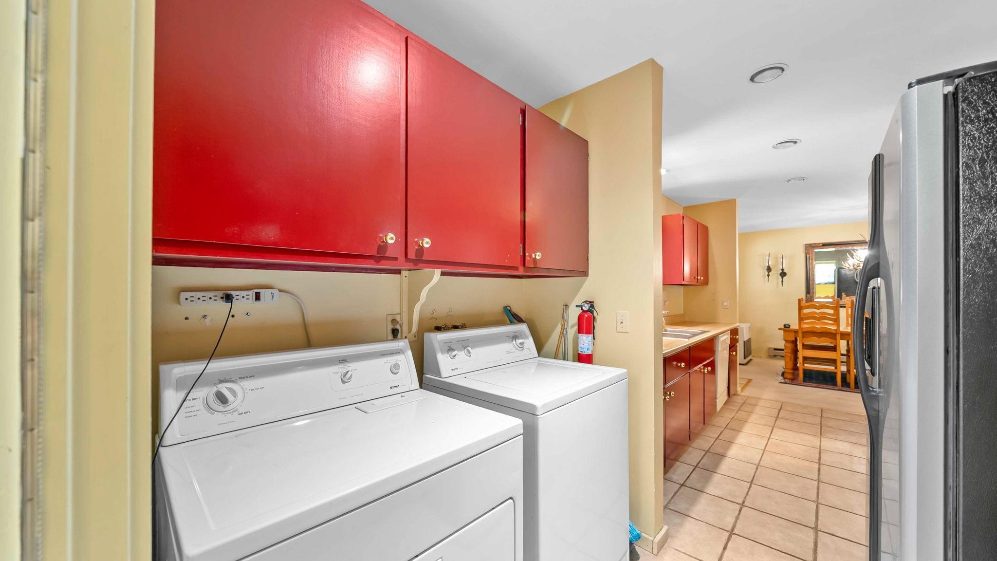 11 Shasta Trail Graeagle, CA 96103 - Photo 14 of 28 a view of washer and dryer with bathroom in the background