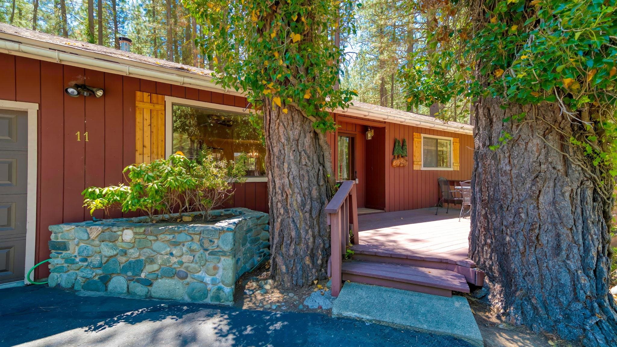 11 Shasta Trail Graeagle, CA 96103 - Photo 2 of 28 a front view of a house with garden
