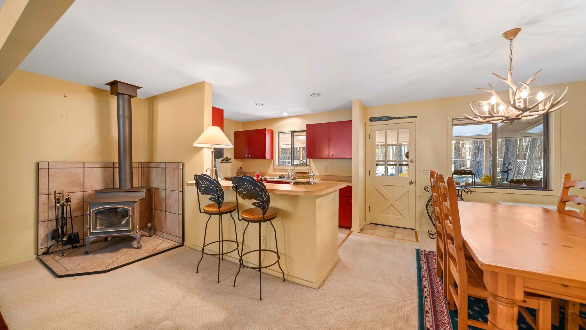 11 Shasta Trail Graeagle, CA 96103 - Photo 26 of 28 a view of a kitchen with kitchen island stainless steel appliances refrigerator stove microwave and cabinets