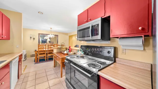 a kitchen with a stove and a microwave