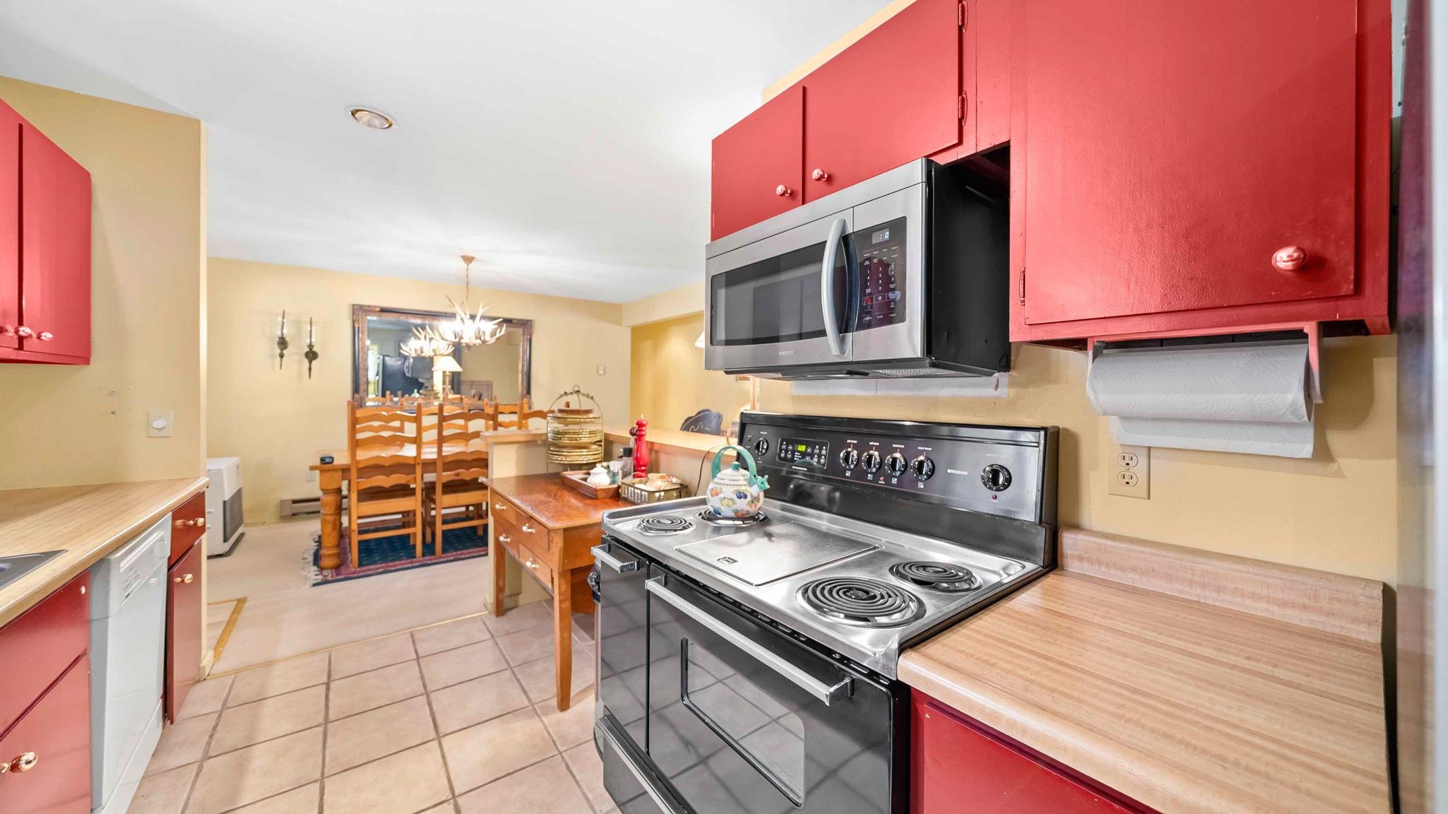 11 Shasta Trail Graeagle, CA 96103 - Photo 3 of 28 a kitchen with a stove and a microwave