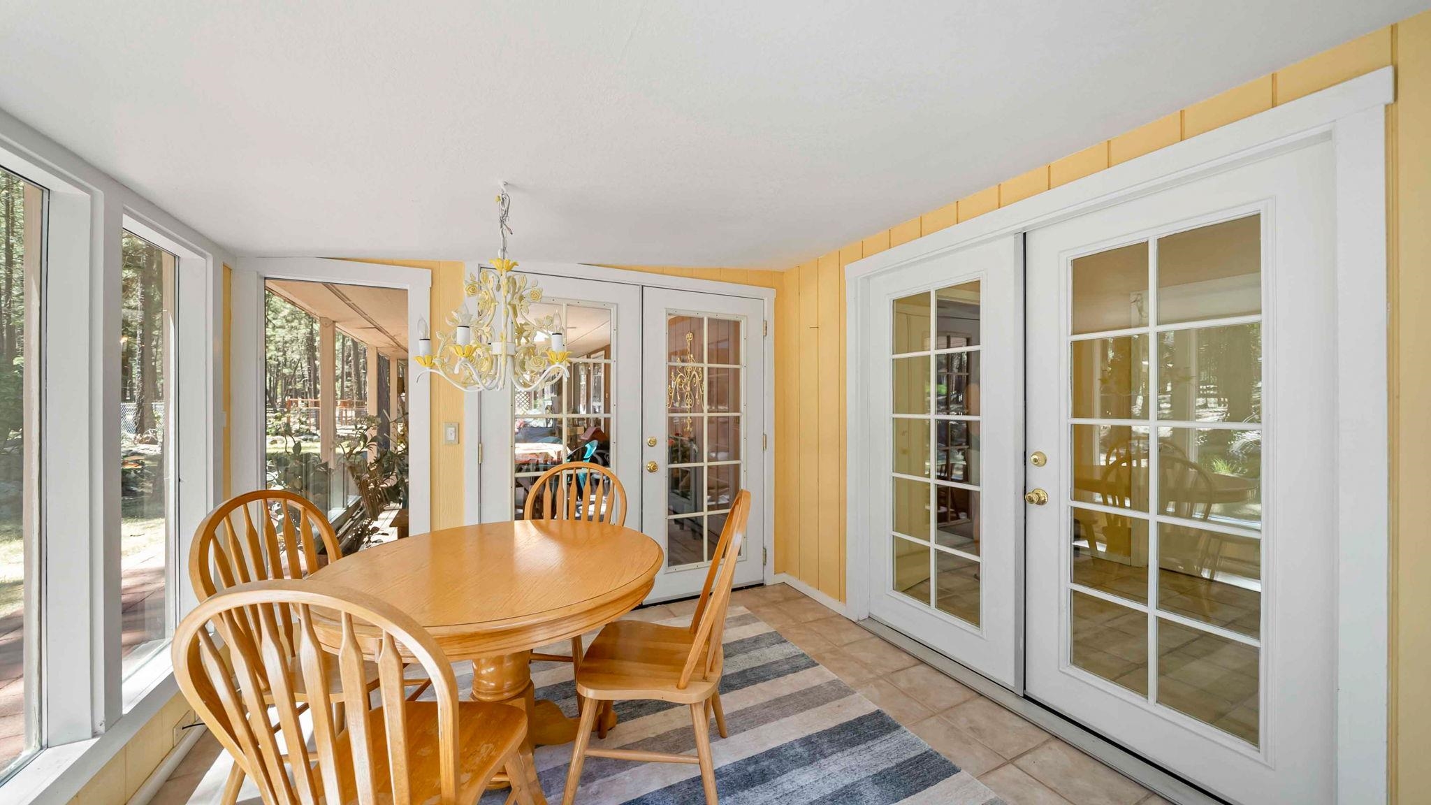11 Shasta Trail Graeagle, CA 96103 - Photo 4 of 28 a dining room with furniture windows and wooden floor
