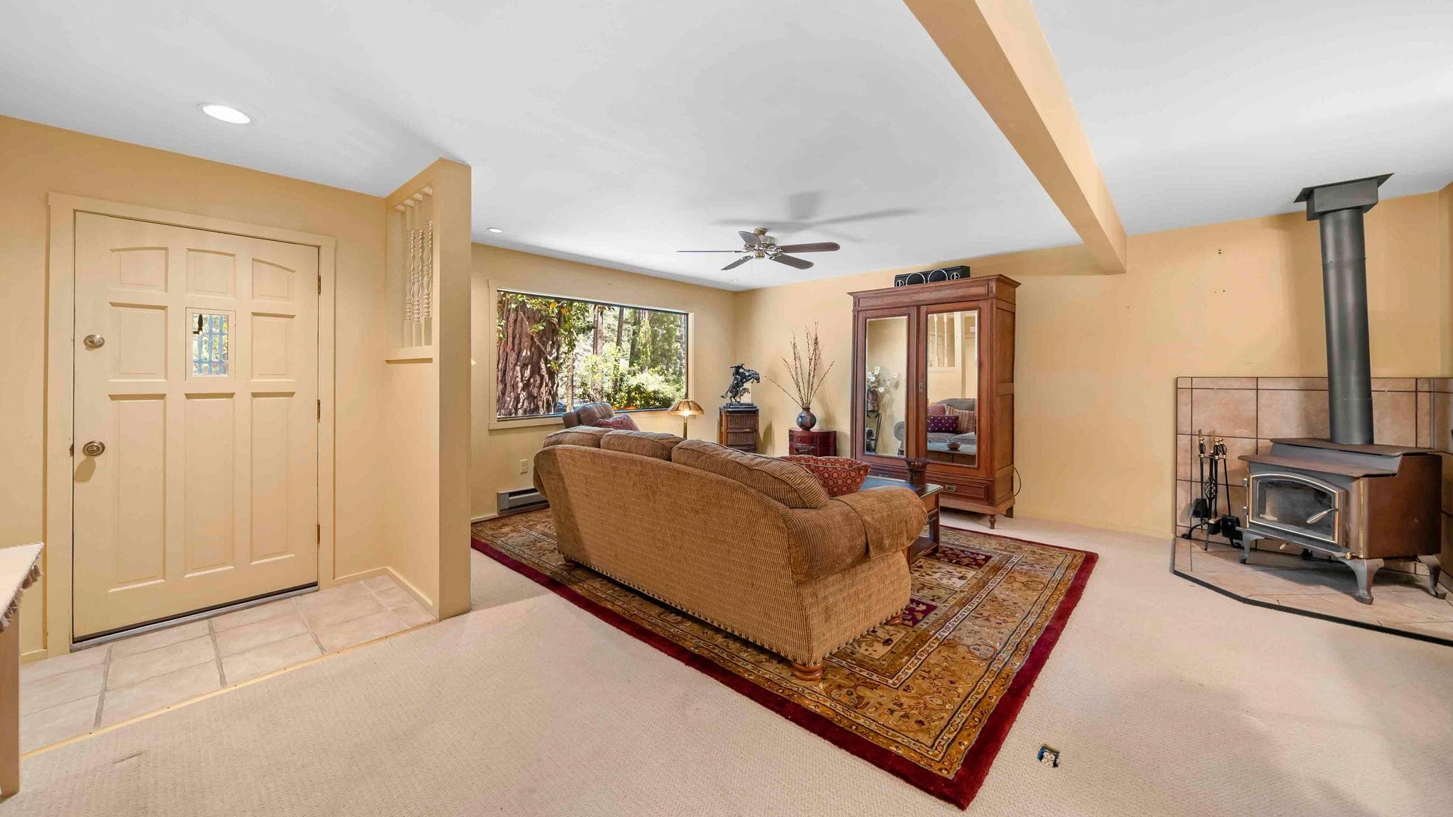 11 Shasta Trail Graeagle, CA 96103 - Photo 10 of 28 a living room with furniture and a fireplace