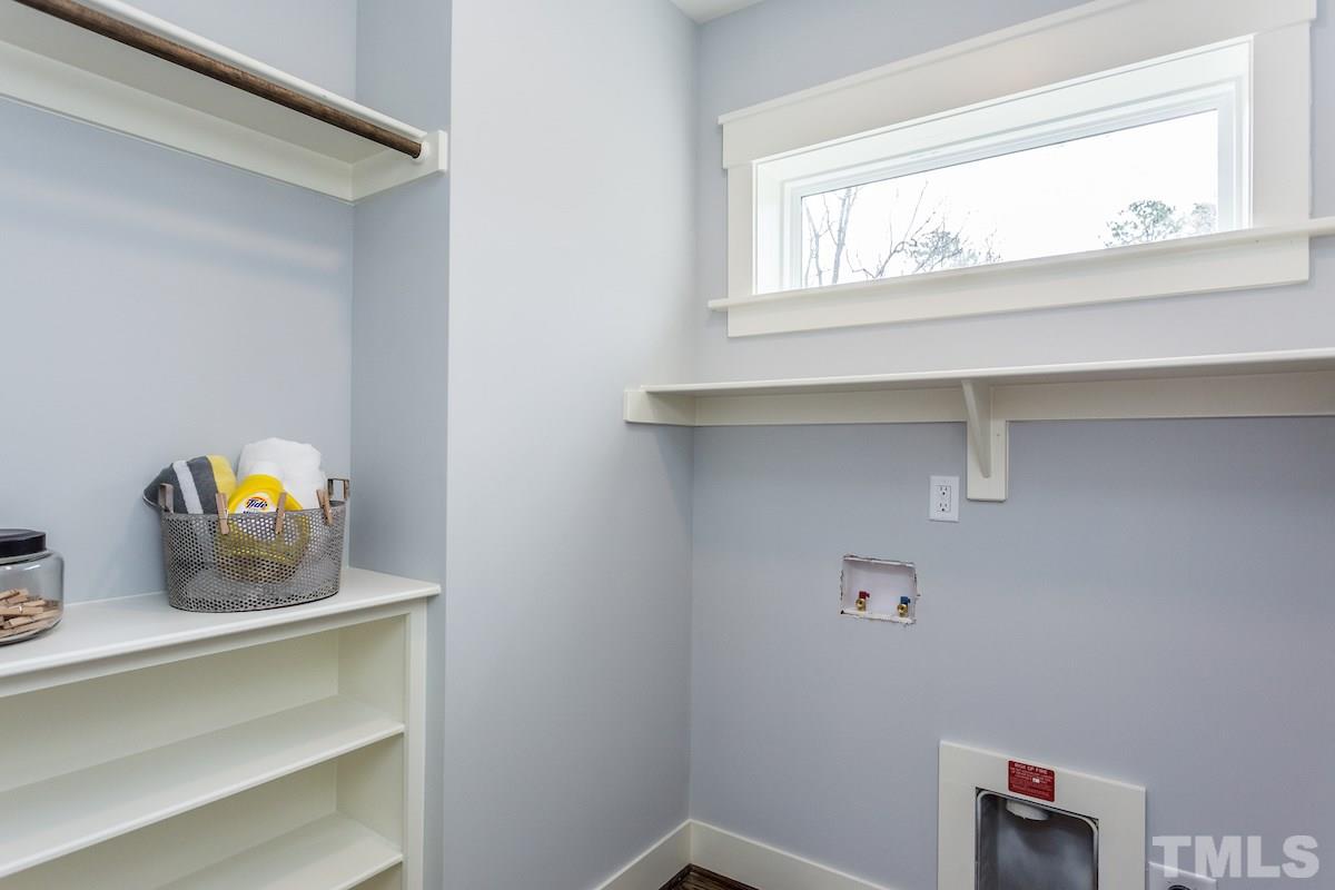 830 Coleman Street Raleigh, NC 27610 - Photo 14 of 24 a view of storage and utility room with a window