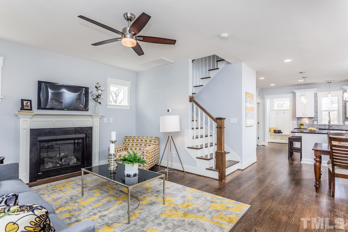 830 Coleman Street Raleigh, NC 27610 - Photo 7 of 24 a living room with furniture and a fireplace
