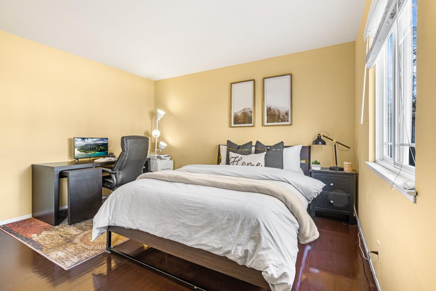 2248 Montezuma Drive Campbell, CA 95008 - Photo 15 of 36 a bedroom with a bed and wooden floor