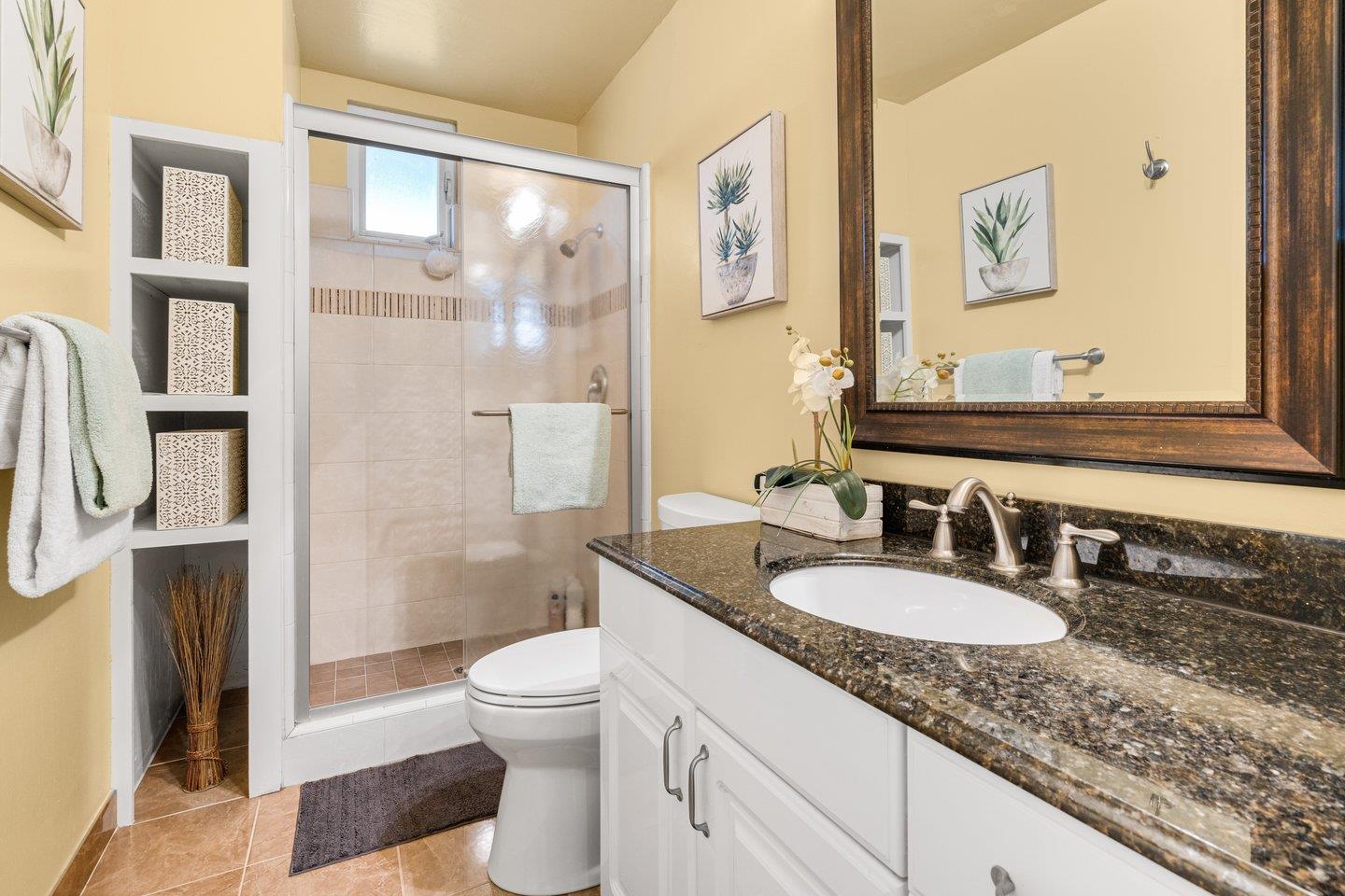 2248 Montezuma Drive Campbell, CA 95008 - Photo 17 of 36 a bathroom with a granite countertop sink toilet and shower