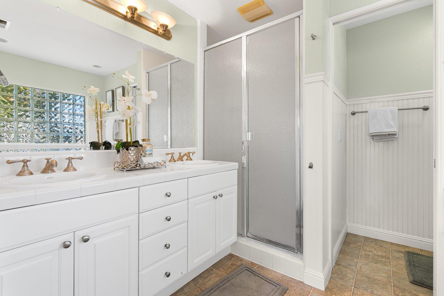 2248 Montezuma Drive Campbell, CA 95008 - Photo 28 of 36 a bathroom with double vanity sink a mirror and a shower