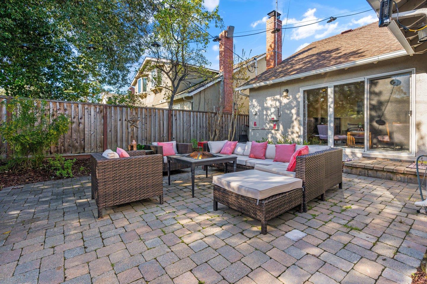 2248 Montezuma Drive Campbell, CA 95008 - Photo 32 of 36 a view of a patio with couches and a table and chairs with wooden fence