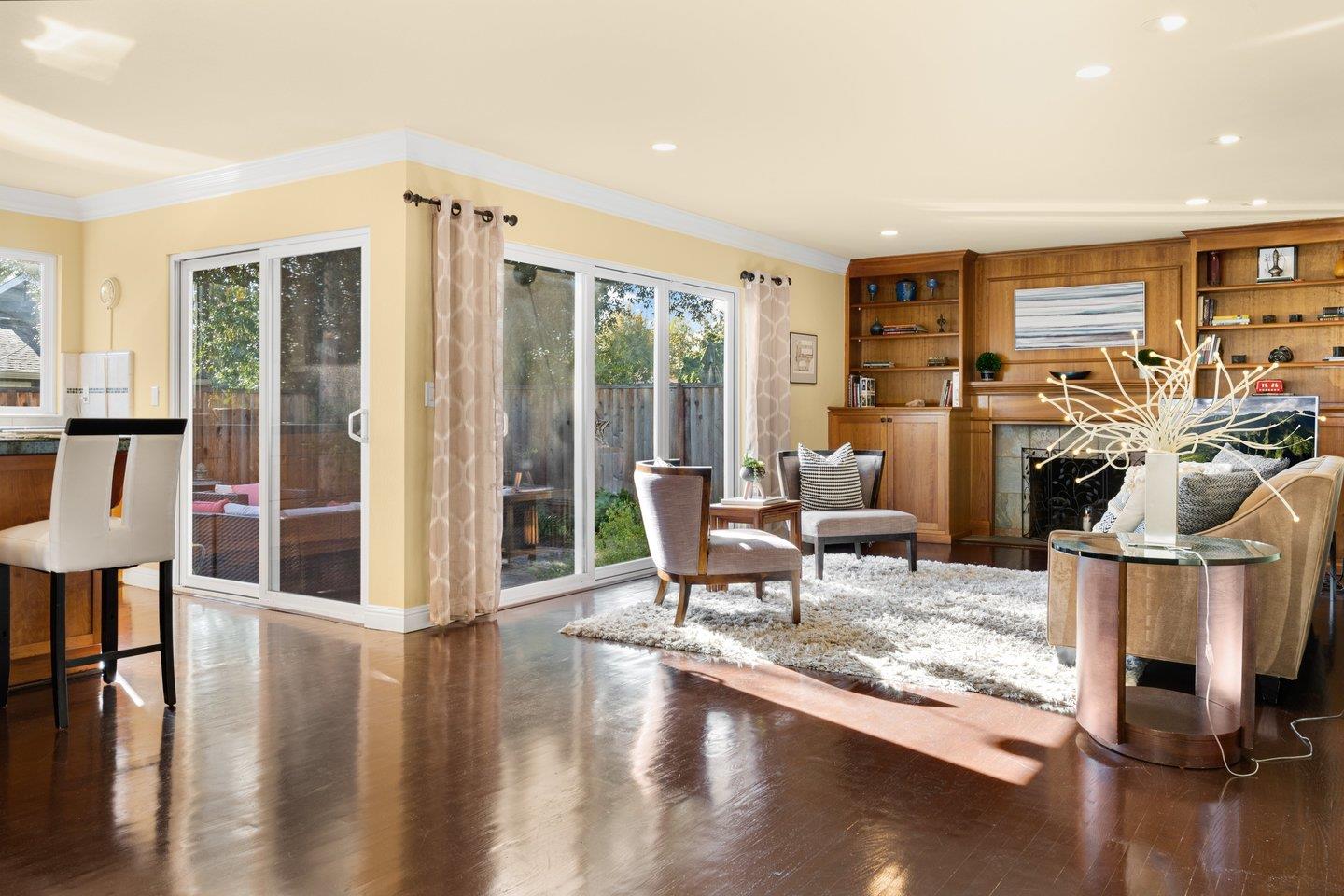 2248 Montezuma Drive Campbell, CA 95008 - Photo 6 of 36 a living room with furniture a fireplace and a table