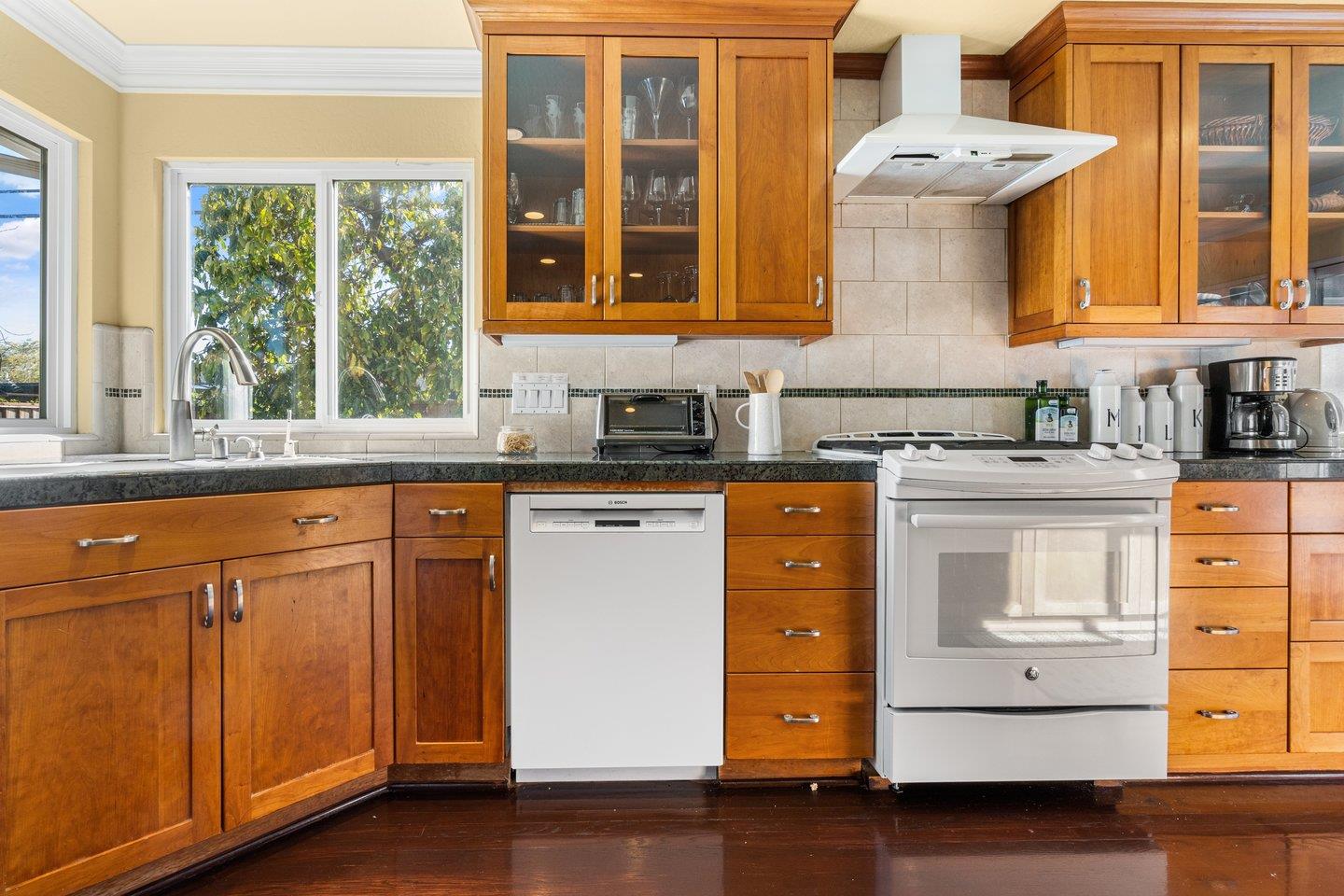 2248 Montezuma Drive Campbell, CA 95008 - Photo 9 of 36 a kitchen with granite countertop white cabinets and white appliances