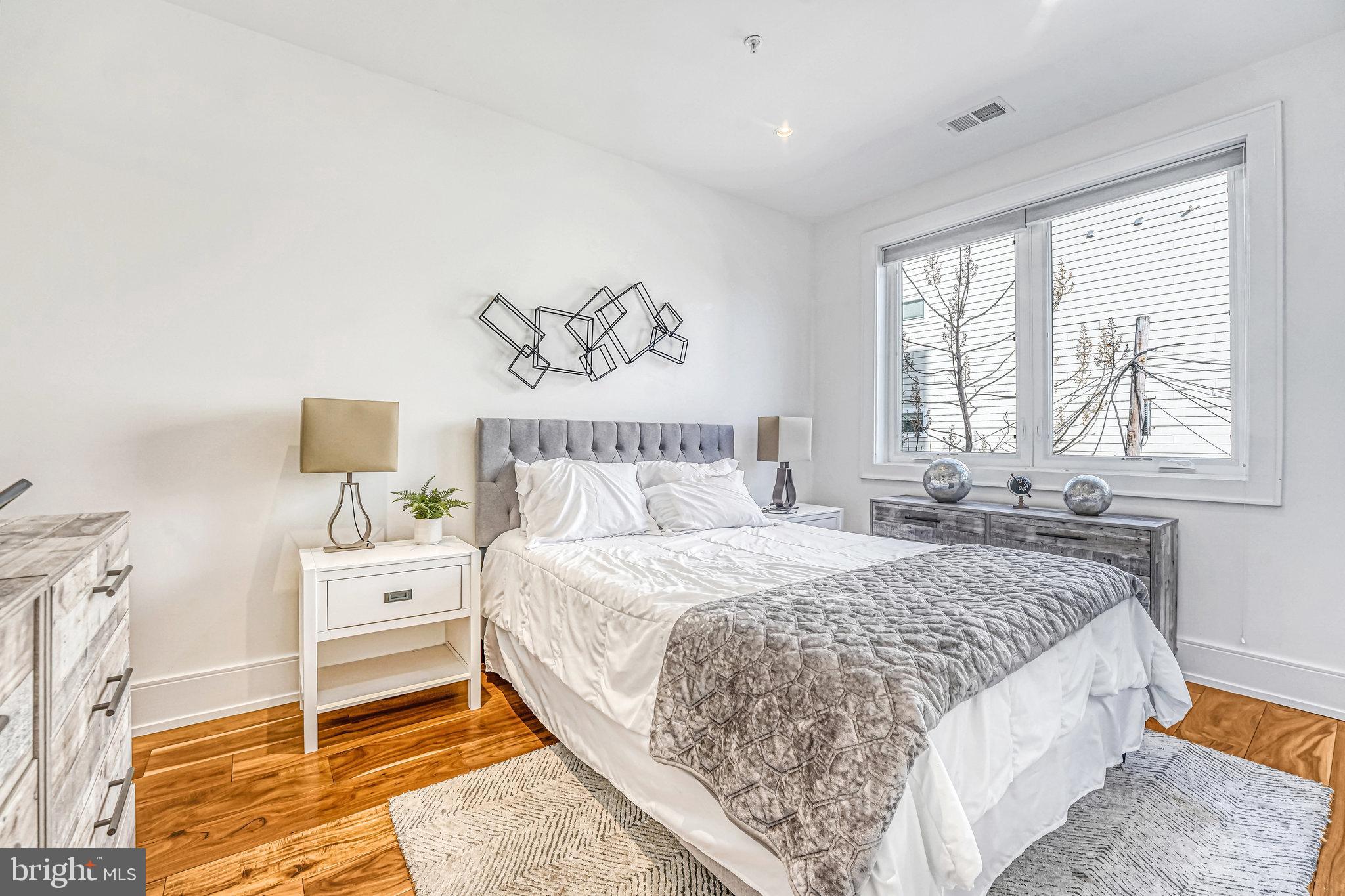 904 H Street Northeast, Unit 1 Washington, DC 20002 - Photo 6 of 17 a bedroom with a bed and a window