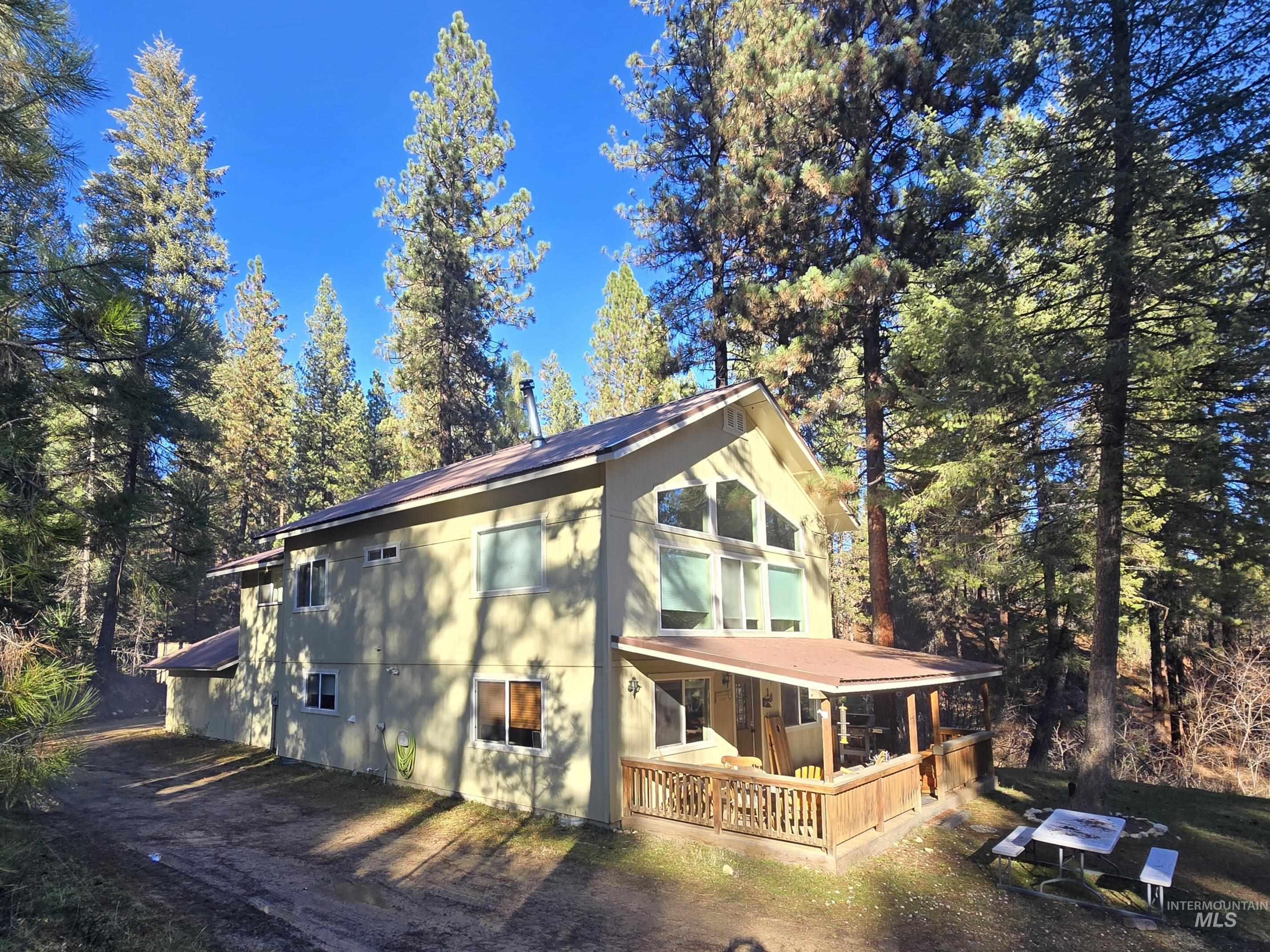14 Forest Trail Road Garden Valley, ID 83622 - Photo 44 of 45 View of property exterior with view of scattered trees and a porch