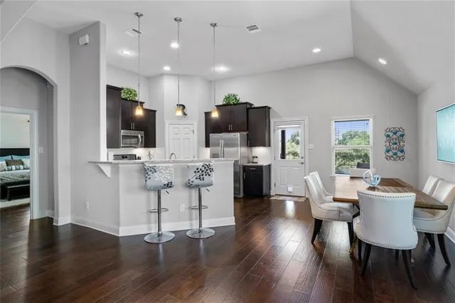 a view of kitchen with cabinets and wooden floor