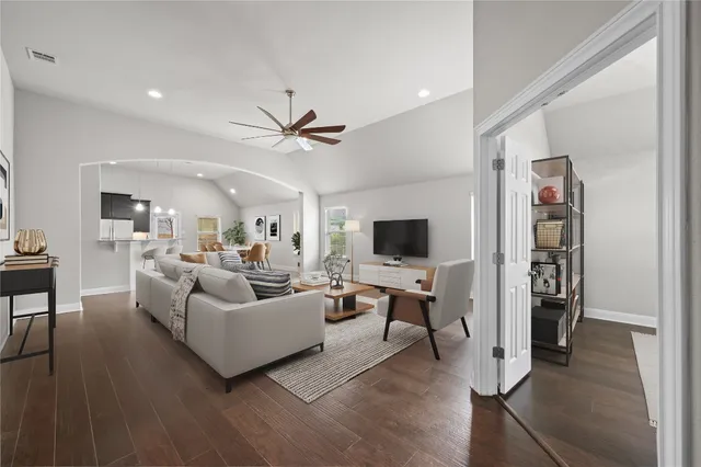 a living room with furniture and a flat screen tv
